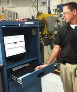 Phil Kapalczynski, business unit manager for Senior Flexonics - GA Precision, Wisconsin, demonstrates GainSeeker's SPC real-time data collection software that's used at this workstation to track tool life. GainSeeker sends real-time alert emails when a tool fails, meets, or exceeds expectations. 